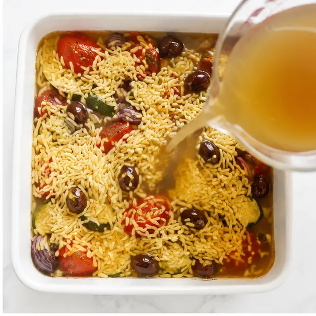 Step 2: Adding orzo and broth to the pan