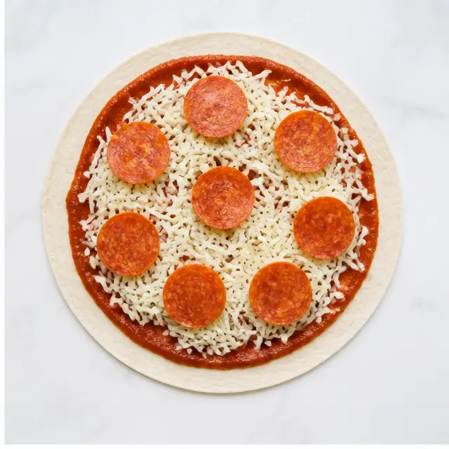 Step 2: Adding shredded mozzarella and pepperoni slices