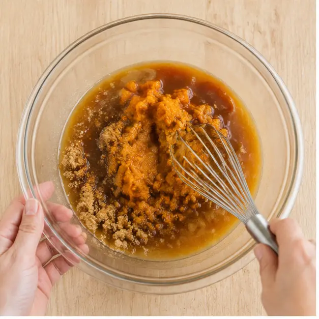 Step 1: Whisking wet ingredients into a smooth pumpkin batter