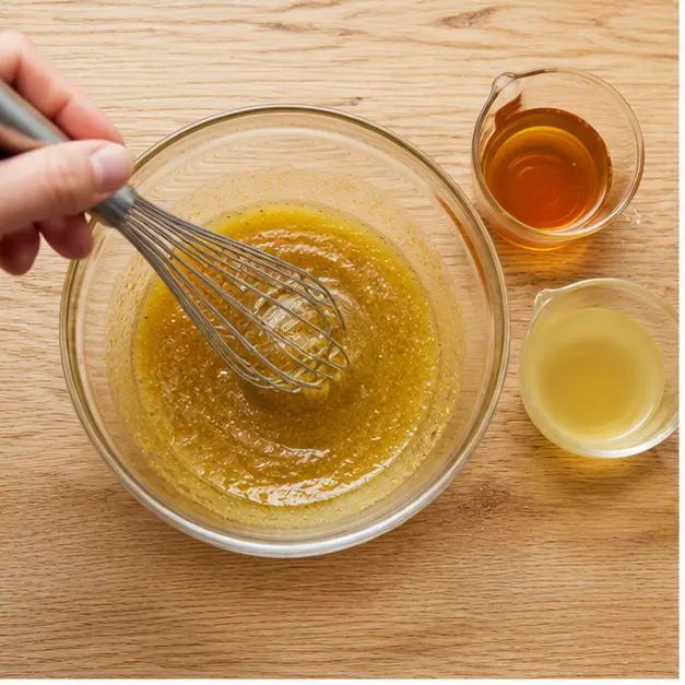 Step 1: Whisking the maple Dijon dressing until emulsified