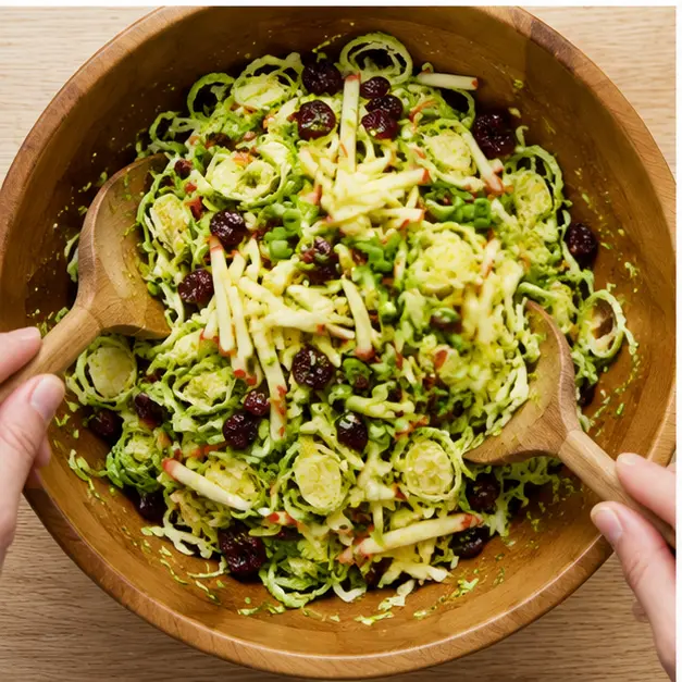 Step 3: Tossing shaved brussels sprouts with apples and green onions