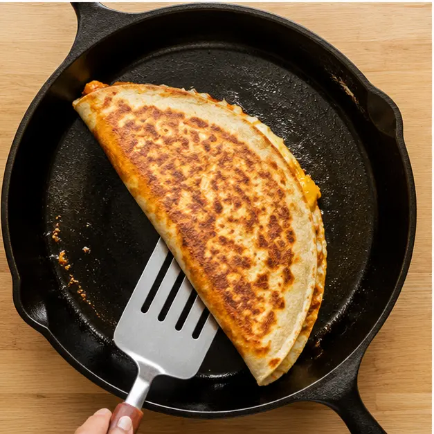 Step 3: Flipping the quesadilla to crisp the second side golden brown
