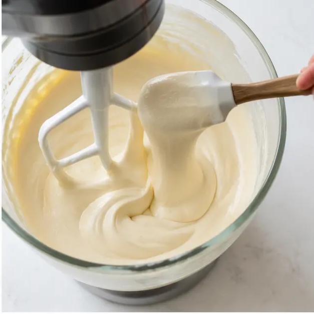 Step 2: Beating the cream cheese filling until smooth and silky in the stand mixer