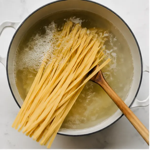 Boiling fettuccine in salted water