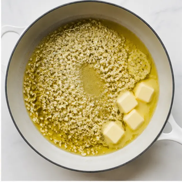 Sautéing garlic in olive oil with melting butter