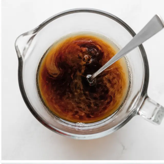 Stir molasses and maple syrup into warm water until combined