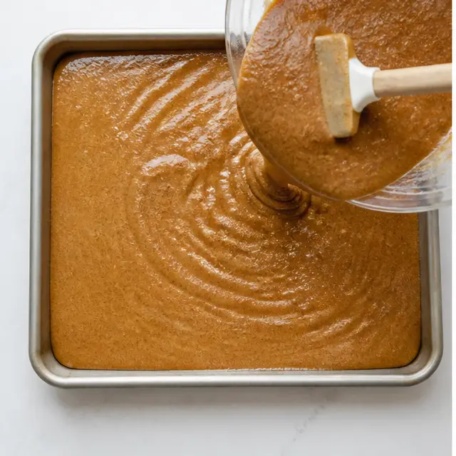 Pour the batter into the half-sheet pan and bake until a toothpick comes out clean