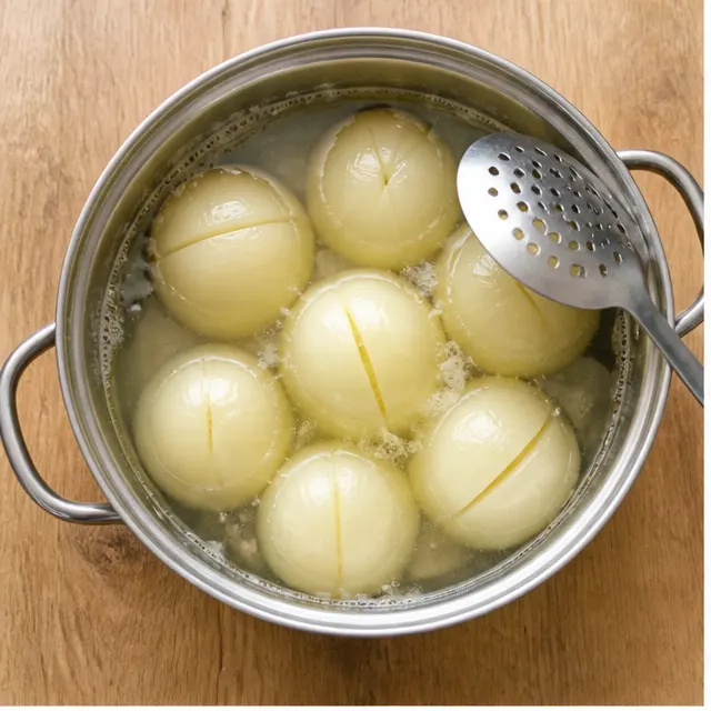 Step 1: Parboiling whole peeled onions until the layers loosen