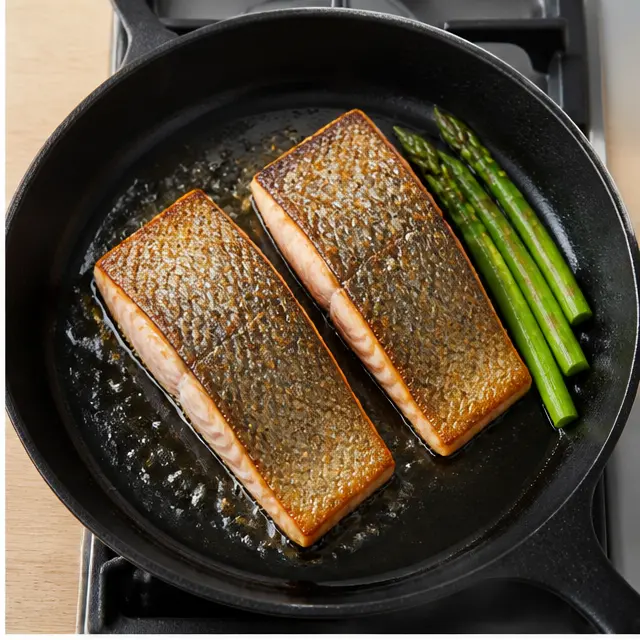 Sear salmon fillets until golden crust forms