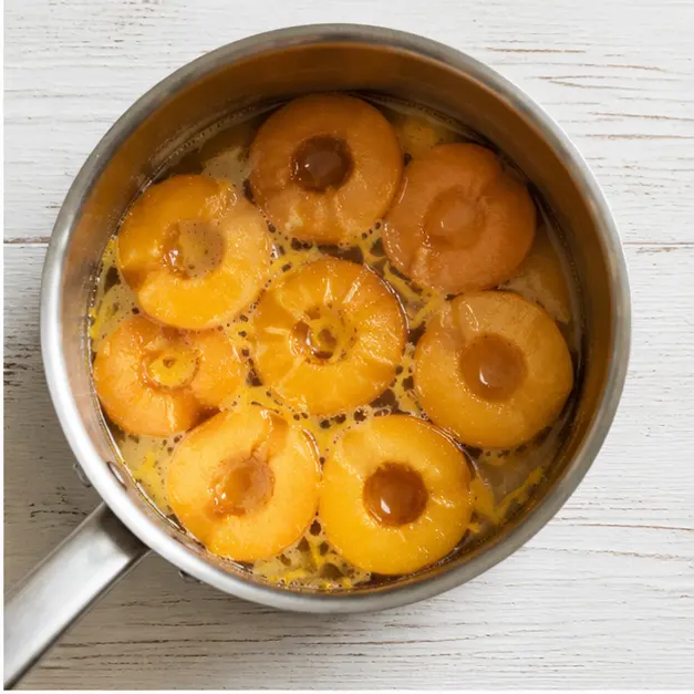 Poach peach halves in sugar and Meyer lemon liquid until the skins wrinkle and slip off.