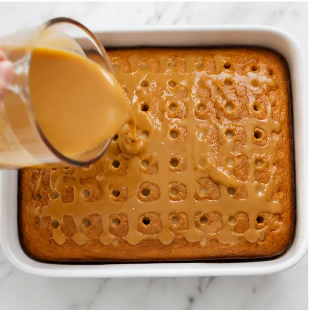 Step 3: Pouring caramel-condensed milk sauce over the cake