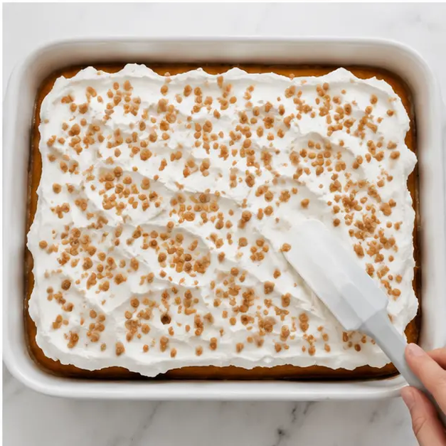 Step 4: Spreading whipped topping and sprinkling toffee bits