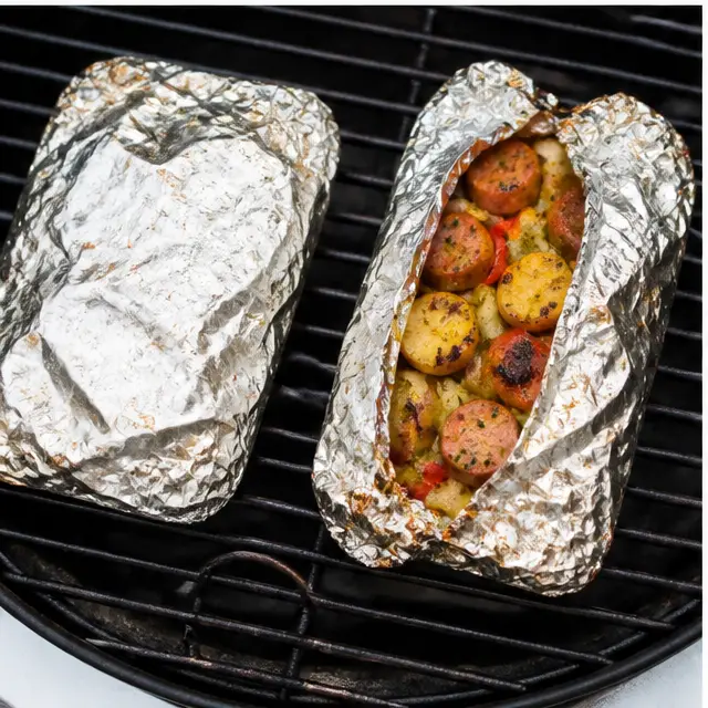 Step 3: Grilling the sealed foil packets on medium-high until the potatoes are fork-tender.