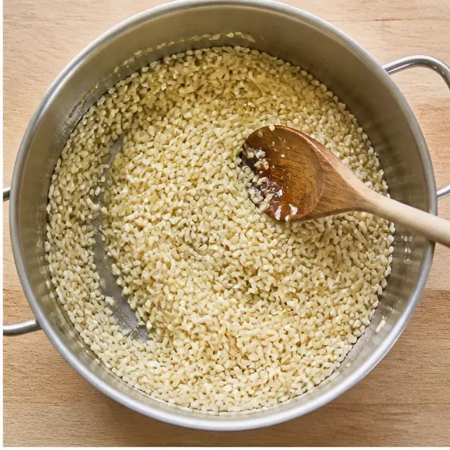 Toasting arborio rice until the grains turn translucent at the edges