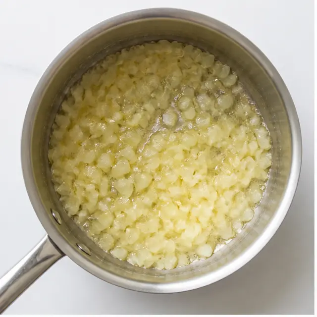 Melting butter and softening onion in a saucepan