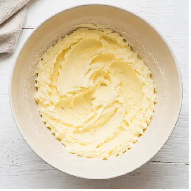 Cream softened butter and sugar into a thick pale paste